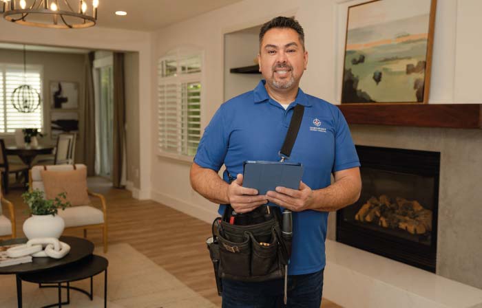 Expert home inspector Oscar Fregoso standing in a modern, well-lit living room, demonstrating the professional and friendly service Northpoint Property Inspections provides to Sacramento area home buyers and sellers.